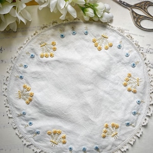 Beautiful antique embroidered yellow and blue  flowers  doily