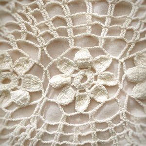 Beautiful off-white  vintage oval crochet doily