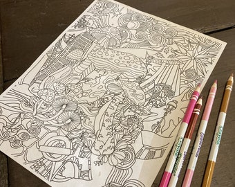 May include: A black and white coloring page featuring a detailed illustration of mushrooms, flowers, and other whimsical elements. The page is on a wooden table with four colored pencils.