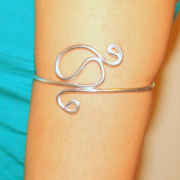 Innovative upper arm cuff armband made of brass or aluminium wire.