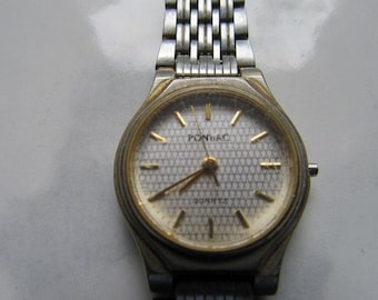 Montre pour pièces Pontiac quarts. Boitier et bracelet acier.Watch for Pontiac quarter watches. Case and steel bracelet.
