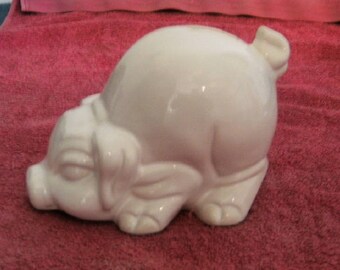 White ceramic piggy bank pig.