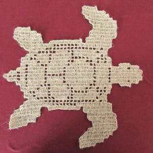 Sea turtle placemat. Handmade crocheted jute twine. Textile decoration, table linen.