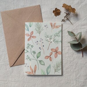 Carte de voeux de Noël d'hiver botanique - Illustration de fleurs et branches enneigées - Carte postale aquarelle