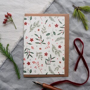 Christmas card with an all-over pattern of different branches, berries and small flowers