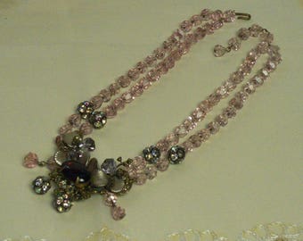 Necklace (196) with 2 rows of pink crystals, central composition with shells, circa 1950's