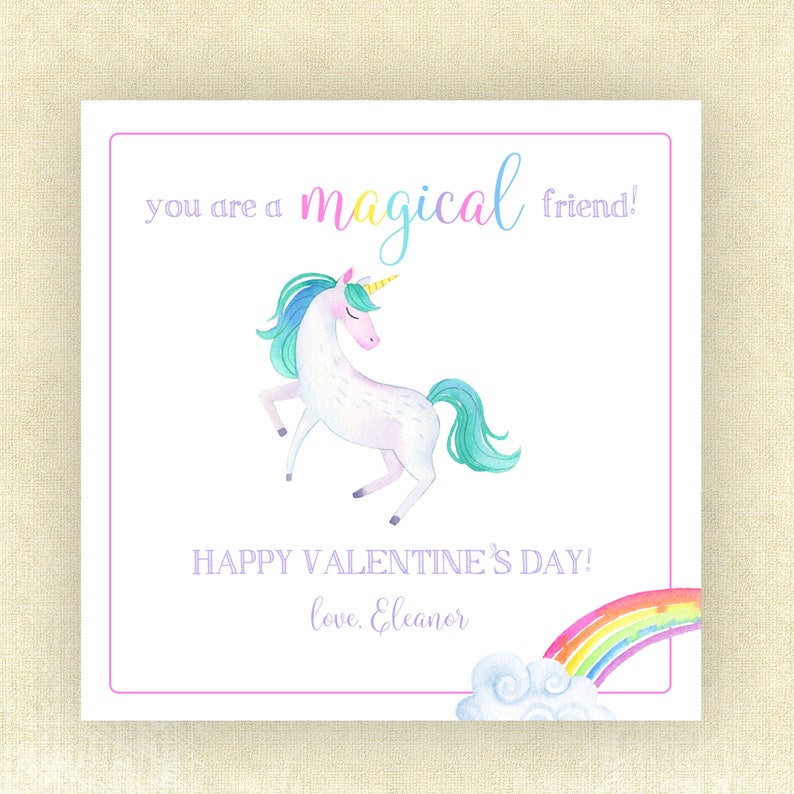 May include: A white unicorn with a rainbow mane and tail stands on a white background. The unicorn has a gold horn and closed eyes. The text "you are a magical friend!" is above the unicorn. Below the unicorn is the text "HAPPY VALENTINE'S DAY! love, Eleanor" and a rainbow with a white cloud.