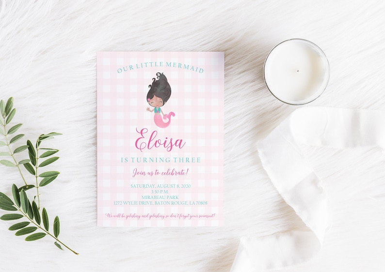 May include: Pink and white gingham patterned invitation with a cartoon mermaid illustration. The invitation reads "Our Little Mermaid Eloisa is turning three. Join us to celebrate! Saturday, August 8, 2020, 3:30 PM, Mirabeau Park, 1272 Wylie Drive, Baton Rouge, LA 70808. We will be polishing and splashing so don't forget your swimsuit!"