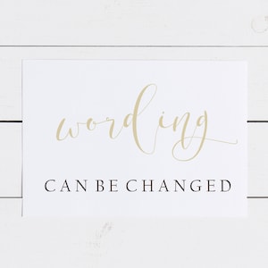 May include: White card with the word "wording" written in gold cursive script. Below the word is the text "CAN BE CHANGED" in black.
