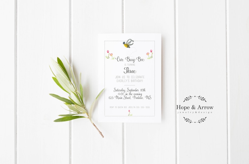 May include: A white invitation card with a bee illustration and the text "Our Busy Bee is turning Three. Join us to celebrate Everley's birthday! Saturday, September 10th, 4:00 in the evening, 125 Main Street,  Pentelic, MS."
