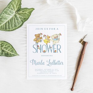 May include: A blue and white baby shower invitation with a cartoon illustration of a teddy bear, a duck, and a puppy. The text reads "Join us for a Shower Honoring Marla Ledbetter Saturday, October 7, 2017 Guntersville Country Club 122 Main Street Guntersville, AL 35976"