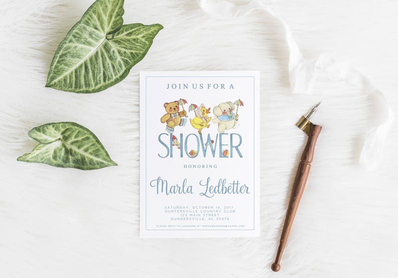 May include: A blue and white baby shower invitation with a cartoon illustration of a teddy bear, a duck, and a puppy. The text reads "Join us for a Shower Honoring Marla Ledbetter Saturday, October 7, 2017 Guntersville Country Club 122 Main Street Guntersville, AL 35976"