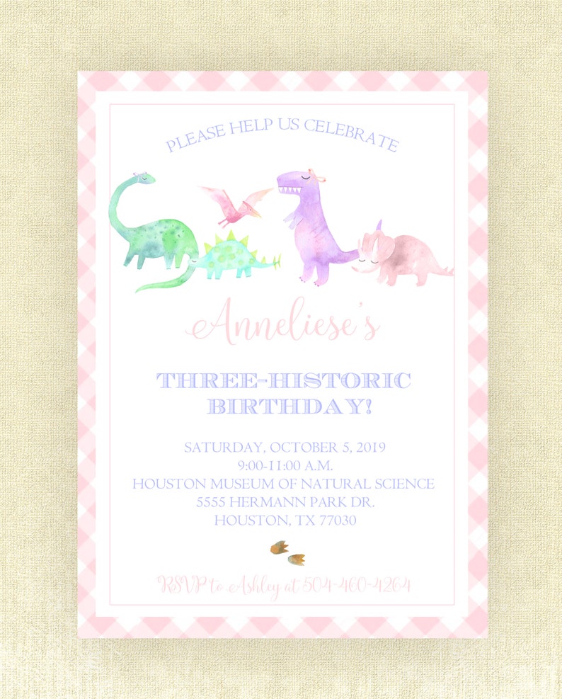 May include: Pink and white gingham patterned invitation with a purple, green, and pink dinosaur illustration. The text reads "Please help us celebrate Anneliese's Three-Historic Birthday!"  Saturday, October 5, 2019, 9:00-11:00 A.M. Houston Museum of Natural Science, 5555 Hermann Park Dr., Houston, TX 77030. RSVP to Ashley at 504-460-4264.