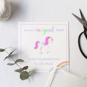May include: A white card with a pink border and a watercolor illustration of a unicorn with a rainbow. The card says "You are a magical friend! Happy Valentine's Day love, Ellie Merkel"