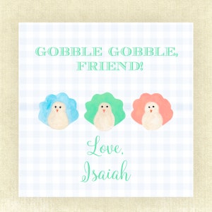 May include: A Thanksgiving card with three cartoon turkeys in blue, green, and pink. The card says "Gobble Gobble Friend!" and is signed "Love, Isaiah".