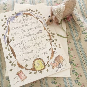 May include: A watercolor illustration of a quote by Beatrix Potter, "What Heaven can be more real than to retain the spirit-world of childhood, tempered and balanced by Knowledge & Common Sense?" The quote is surrounded by a wreath of green leaves and a small mouse is peeking out from behind the wreath.