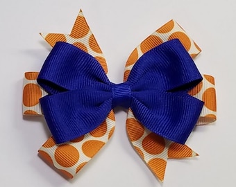 Lazo para el cabello de 3.5" en azul rey, naranja y lunares, con los colores del equipo deportivo de la escuela. *Puedes elegir el color del lazo*.