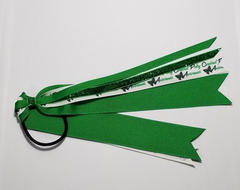 May include: Green and white ribbon hair tie with a green glitter ribbon and black butterfly graphics with the text "Cerebral Palsy Cerebral Palsy Awareness Awareness".