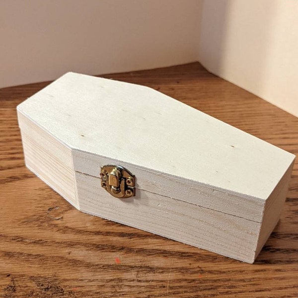 Coffin or casket plain unfinished wood, hinged with brass look hinges and clasp.  Decorate for trinket box or pipe box.