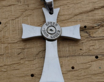 Stainless Steel Handmade Bullet Cross Necklace. Comes with Nickel or Brass Bullets. Optional Crystal