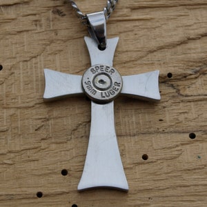 Stainless Steel Handmade Bullet Cross Necklace. Comes with Nickel or Brass Bullets. Optional Crystal