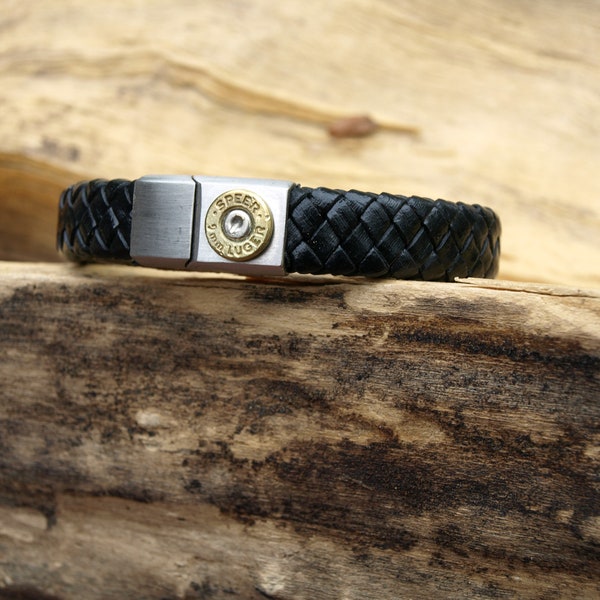 Black Leather Bullet Bracelet with Slider Magnet Opener. Your choice of 380, 9, 38, 357, or 40 Caliber Bullet. Optional Crystal