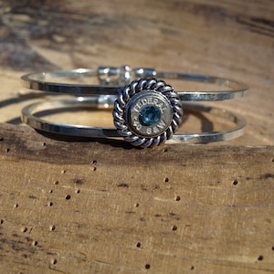Silver Plated Hinged Rope Style Bullet Bracelet. Your Choice of 38, 357, 40 or 45 Caliber Bullet. Optional Swarovski Crystals.