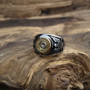 Handmade Stainless Steel "Brass 45 Auto  Bullet Ring" with Eagles on each side.