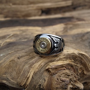 Handmade Stainless Steel "Brass 45 Auto  Bullet Ring" with Eagles on each side.