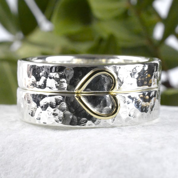 Silver wedding rings and romantic pattern in heart shape