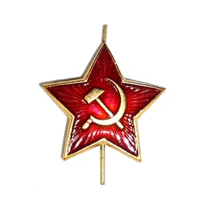 May include: A red five-pointed star with a gold hammer and sickle in the center. The star is on a gold pin.