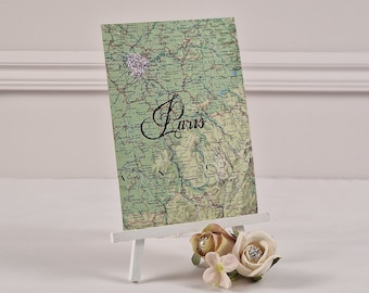 World Map handwritten destination wedding table names.