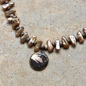 Taupe Pearl Necklace with Hand and Stars Pendant