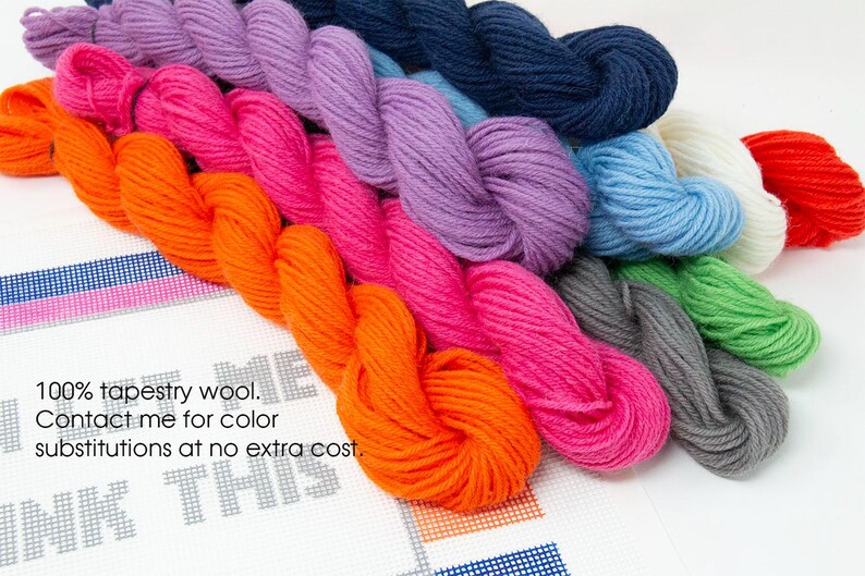 May include: A collection of 10 skeins of tapestry wool yarn in various colors, including orange, pink, purple, blue, gray, and green. The yarn is arranged in a row, with the ends of each skein overlapping the next. The yarn is 100% tapestry wool and is available in a variety of colors. Contact the seller for color substitutions at no extra cost.