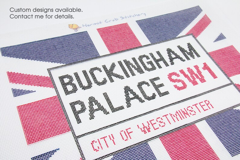 May include: A needlepoint canvas with a red, white, and blue Union Jack design. The canvas features the text "BUCKINGHAM PALACE SW1 CITY OF WESTMINSTER".