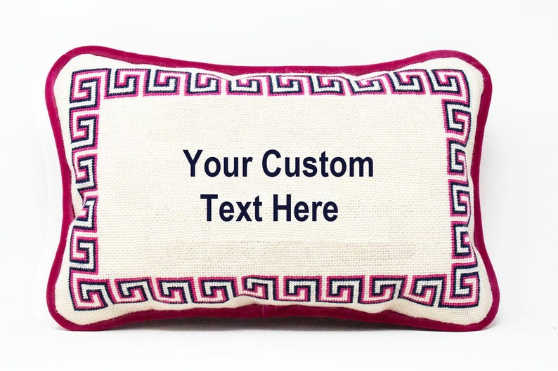 May include: A white pillow with a pink and blue Greek key border. The pillow is embroidered with the text "Your Custom Text Here".