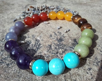 Classic A Grade 8mm Gemstone Chakra / Rainbow Crystal Bracelet. Infused with Reiki energy. With 18k gold plated spacer beads. Elastic. 18cm.
