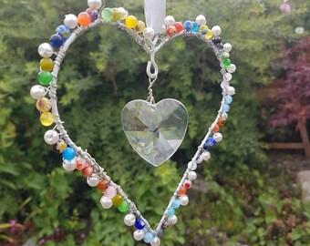 Pretty hanging beaded heart suncatcher. Home is where the heart is! Home decor sent with Reiki energy. Feng shui. For indoors only.