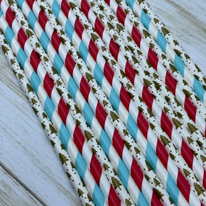 May include: A bundle of red and blue striped paper straws with a gold and white pattern of small Christmas trees.
