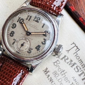 Rolex Oyster Junior Sports, 1941. Rare Retailer’s Signed Dial with Original Box.