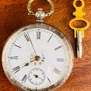 SILVER POCKET WATCH With Ornate Dial.  Key Wind.