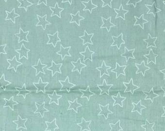 May include: A close-up of a fabric featuring a repeating pattern of white outline stars on a pale teal background. The stars are evenly spaced and vary in size, creating a textured appearance.