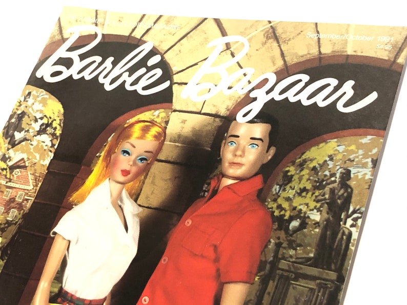 May include: A vintage Barbie Bazaar magazine cover featuring Barbie and Ken dolls in a college setting. The cover features the text "Barbie Bazaar" in white cursive lettering against a brown background.