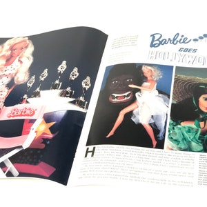 May include: A vintage magazine cover featuring Barbie dolls in a Hollywood setting. The cover features the text "Barbie Goes Hollywood" and images of Barbie dolls dressed in glamorous outfits.