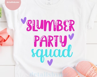 May include: White t-shirt with the text "Slumber Party Squad" in pink, blue, and purple lettering with hearts.