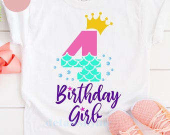 May include: A white t-shirt with a pink number four with a teal mermaid tail design. The number four has a gold crown on top. The text "Birthday Girl" is below the number four in purple.
