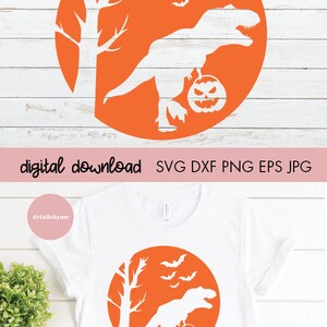May include: A white silhouette of a dinosaur holding a jack-o'-lantern in front of a tree and bats against an orange circle. The text "digital download SVG DXF PNG EPS JPG" is below the circle.
