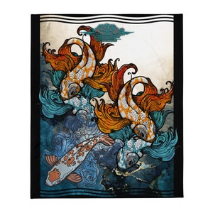 May include: A black blanket with a detailed illustration of koi carp. The fish have orange and white patterns, with flowing orange and blue accents. The design includes water and a decorative border.