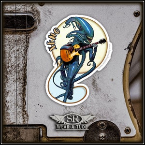 XENOMORPH sticker of Alien playing Les Paul Gold top guitar