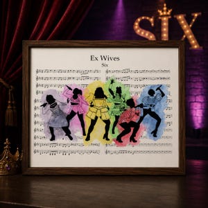 May include: A framed print featuring a musical score background with the text "Ex Wives Six." Silhouetted figures in colorful costumes are depicted, each with a microphone or prop. The frame is dark brown.